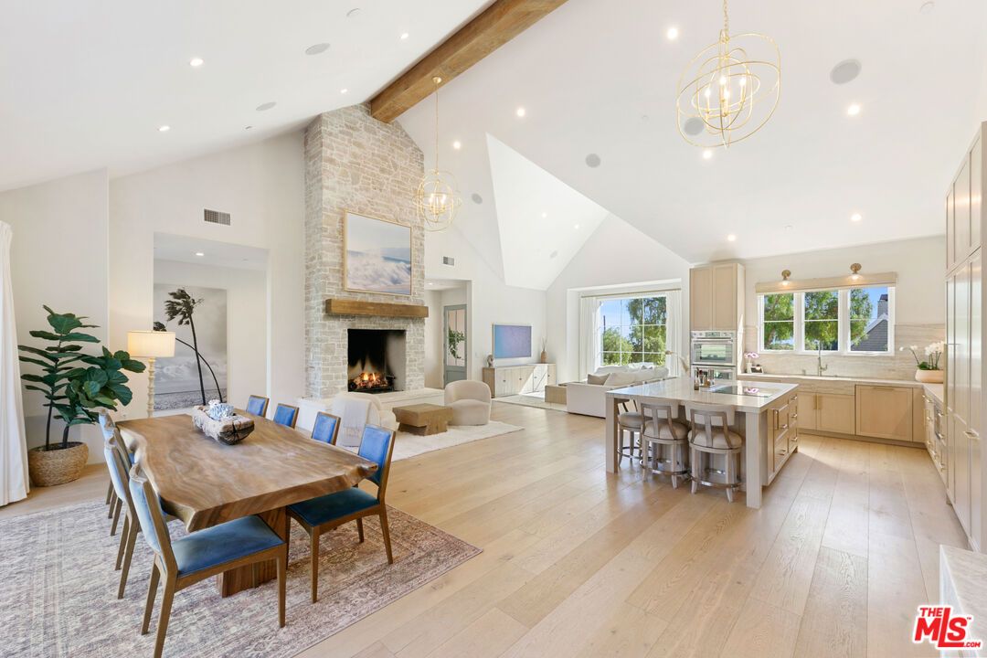 Chandelier, Dining room, Fireplace, Interior, Kitchen, Living room, Pendant Lights, Recessed Lighting, Stone Walls, Wooden Beams, Wood Texture Flooring