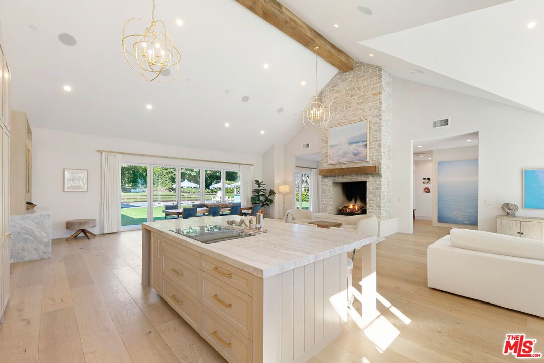 Chandelier, Fireplace, Interior, Living room, Pendant Lights, Recessed Lighting, Wooden Beams, Wood Texture Flooring