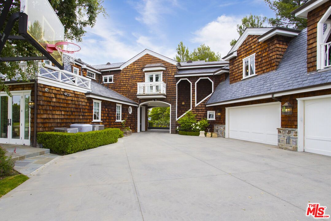 Attached, Exterior, Facade, Brick Facade, Solar Panels, Tudor Revival