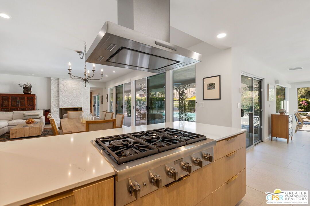 Chandelier, Dining room, Fireplace, Interior, Kitchen, Living room, Recessed Lighting, Stainless Steel Appliances