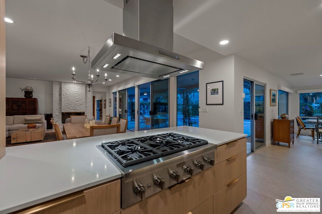 Chandelier, Dining room, Fireplace, Interior, Kitchen, Living room, Pendant Lights, Recessed Lighting, Stainless Steel Appliances