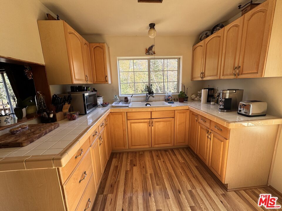 Interior, Kitchen, Tile Countertops, Wood Texture Flooring