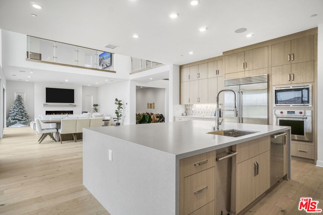 Dining room, Interior, Kitchen, Living room, Recessed Lighting, Stainless Steel Appliances, Wood Texture Flooring