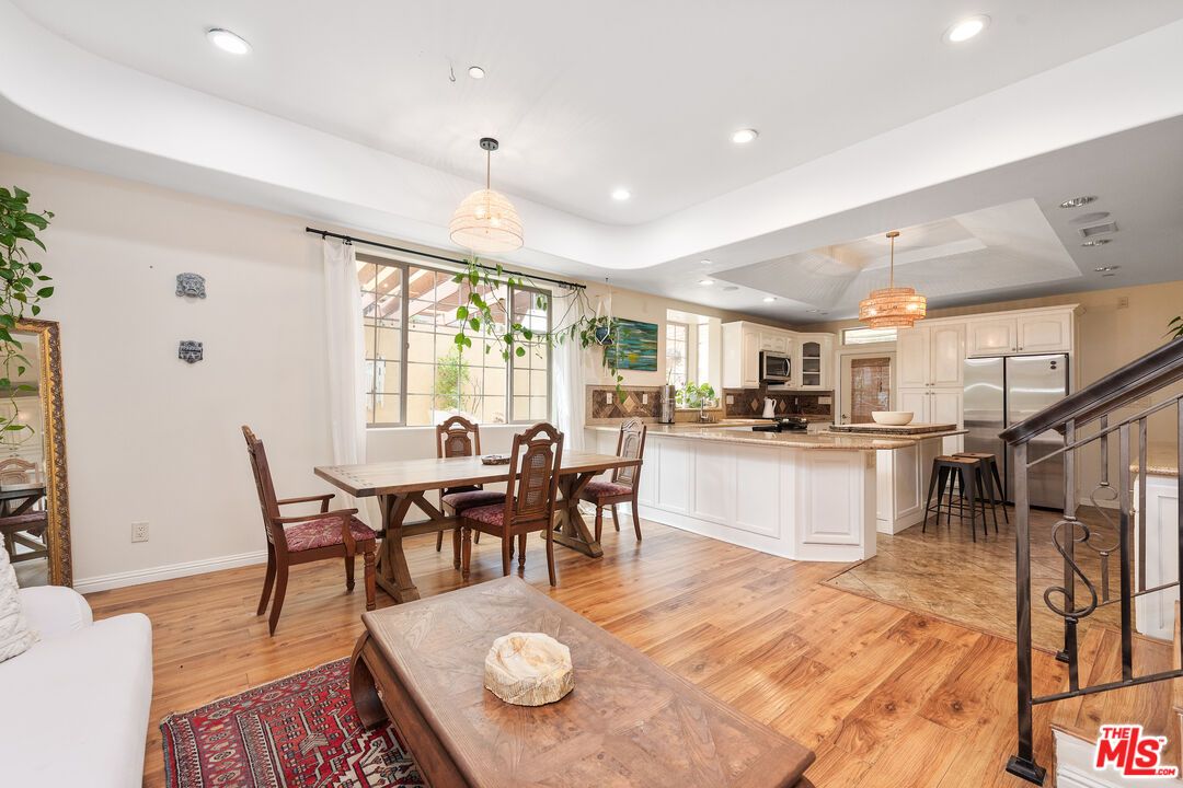 Chandelier, Dining room, Interior, Kitchen, Pendant Lights, Recessed Lighting, Stainless Steel Appliances, Wood Texture Flooring