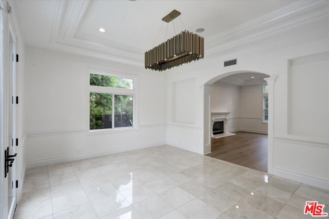 Chandelier, Empty room, Fireplace, Interior, Pendant Lights, Recessed Lighting, Wood Texture Flooring
