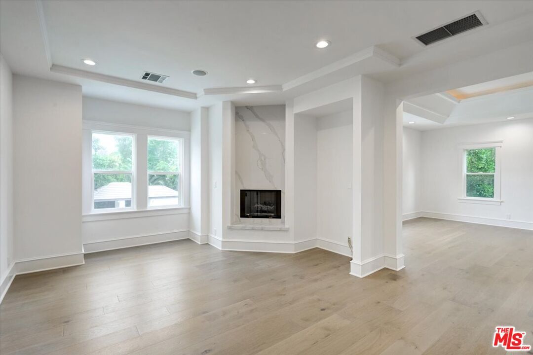 Empty room, Fireplace, Interior, Marble Walls, Recessed Lighting, Wood Texture Flooring