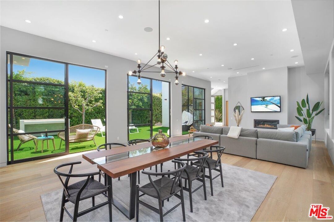 Dining room, Fireplace, Interior, Living room, Pendant Lights, Recessed Lighting, Wood Texture Flooring