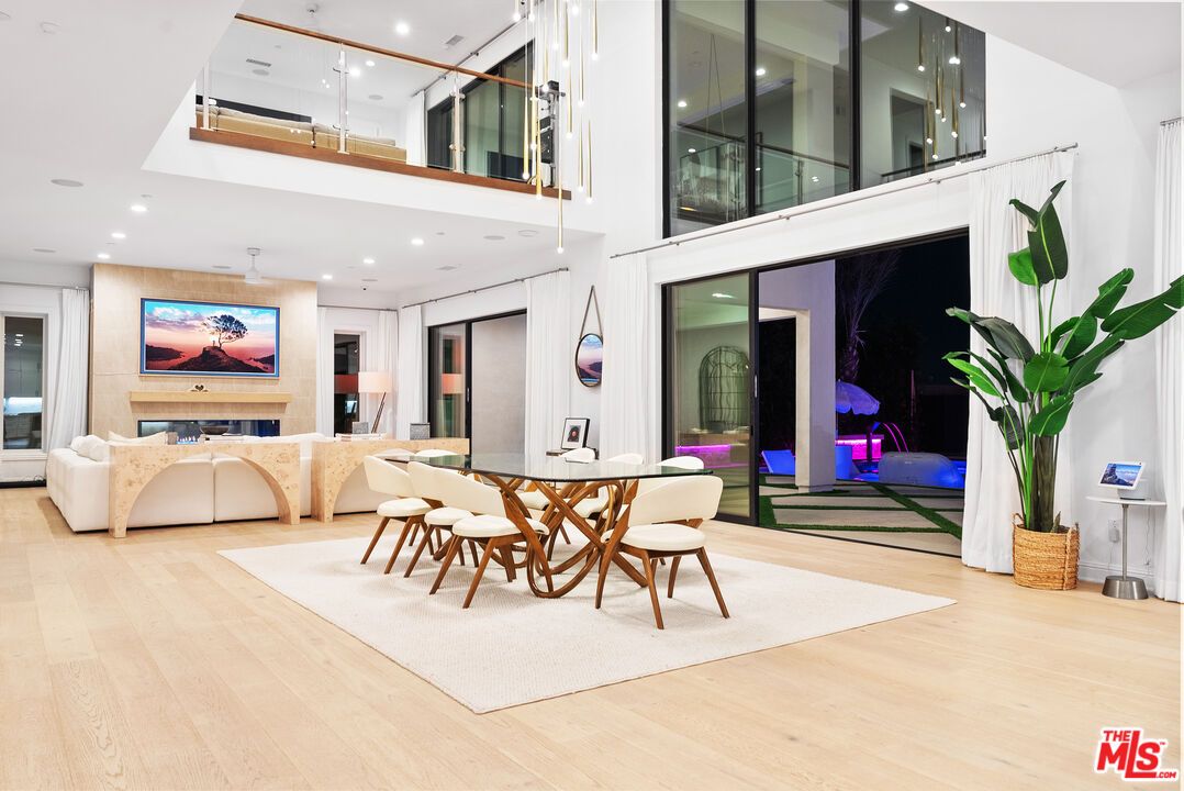 Dining room, Fireplace, Interior, Living room, Recessed Lighting, Wood Texture Flooring