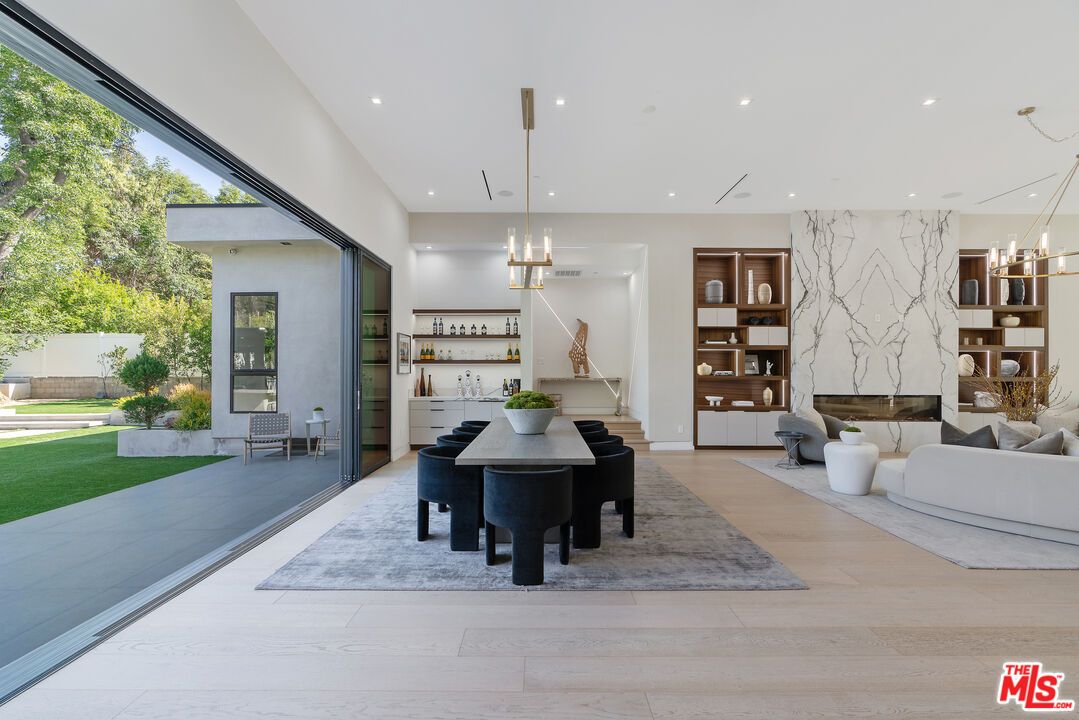 Dining room, Fireplace, Interior, Living room, Marble Walls, Pendant Lights, Recessed Lighting, Wood Texture Flooring