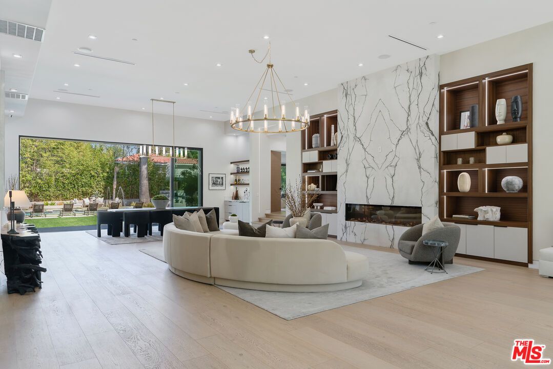 Fireplace, Interior, Living room, Marble Walls, Pendant Lights, Recessed Lighting, Wood Texture Flooring