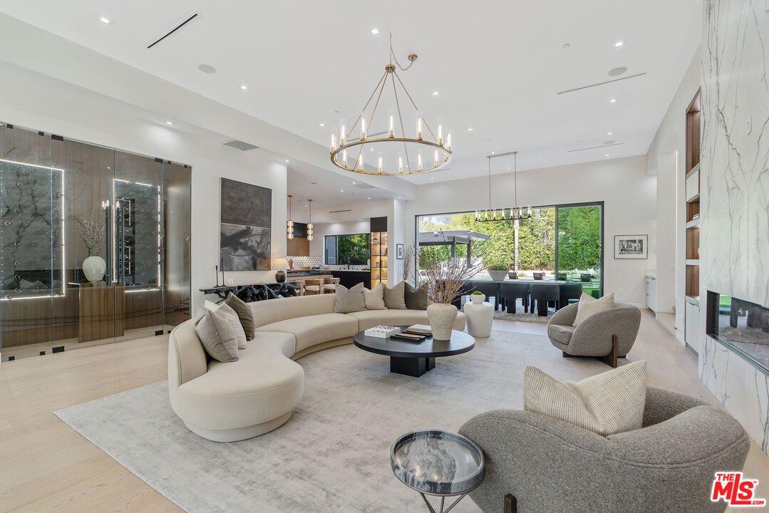 Chandelier, Dining room, Fireplace, Interior, Living room, Pendant Lights, Recessed Lighting, Wood Texture Flooring