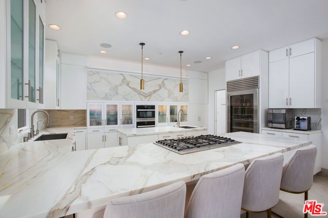 Interior, Kitchen, Marble Walls, Pendant Lights, Recessed Lighting, Stainless Steel Appliances