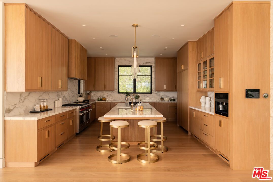 Interior, Kitchen, Marble Walls, Pendant Lights, Recessed Lighting, Stainless Steel Appliances, Wood Texture Flooring