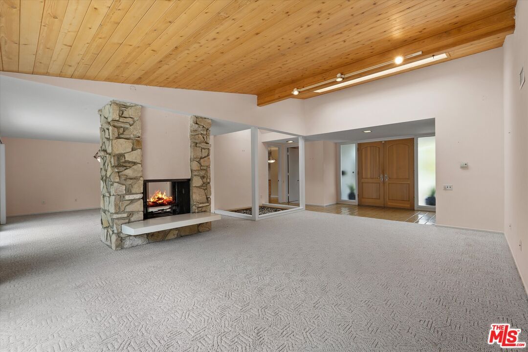 Empty room, Fireplace, Interior, Recessed Lighting, Stone Walls, Wooden Ceilings
