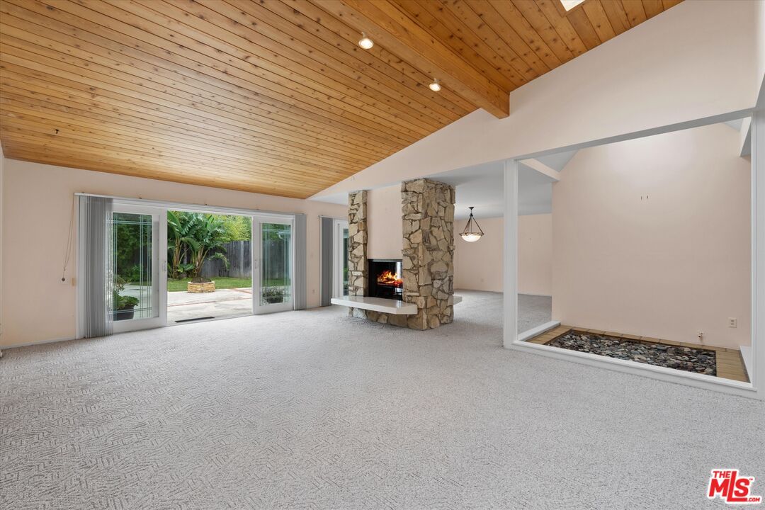 Empty room, Fireplace, Interior, Recessed Lighting, Stone Walls, Wooden Beams, Wooden Ceilings