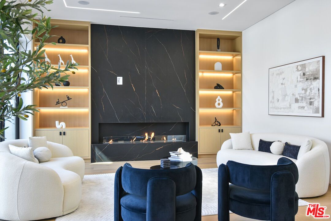 Fireplace, Interior, Living room, Marble Walls, Recessed Lighting, Wood Texture Flooring