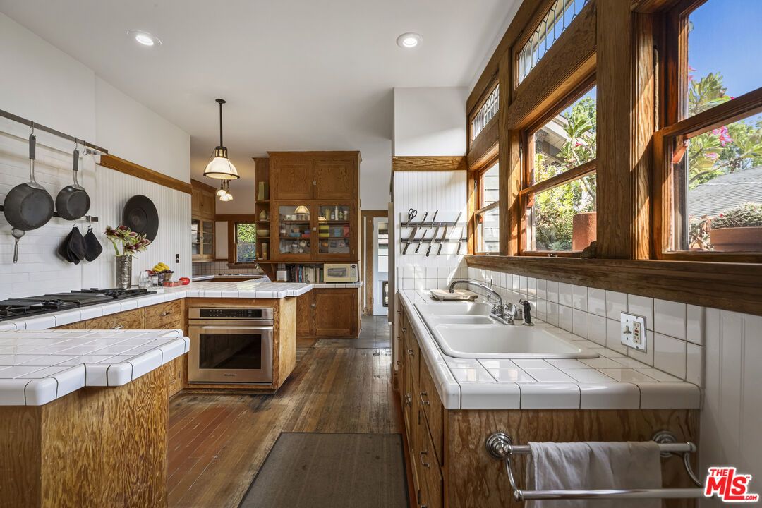 Interior, Kitchen, Pendant Lights, Recessed Lighting, Tile Countertops, Wood Texture Flooring