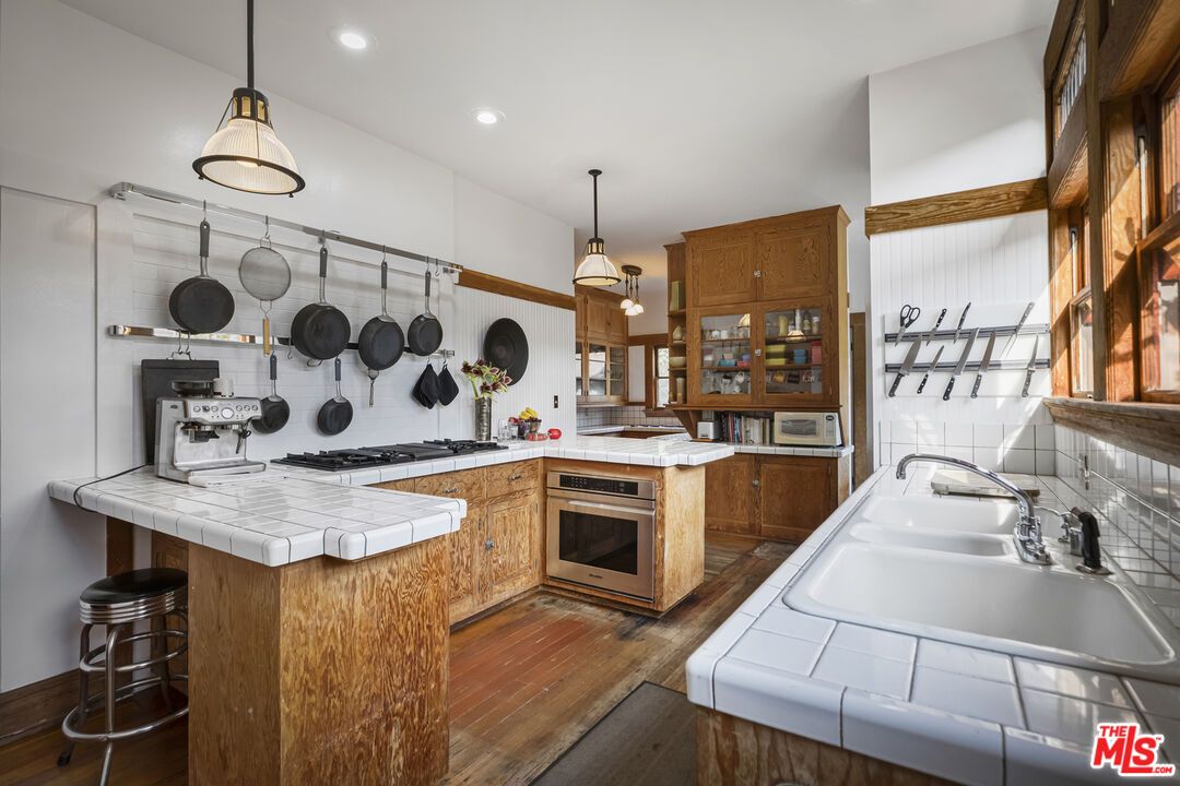 Interior, Kitchen, Pendant Lights, Recessed Lighting, Tile Countertops, Wood Texture Flooring