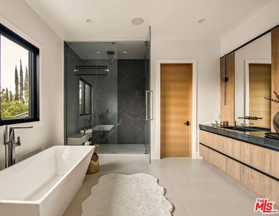 Bathroom, Dual Sink Vanities, Free Standing Baths, Glass Shower, Interior, Marble Walls, Recessed Lighting