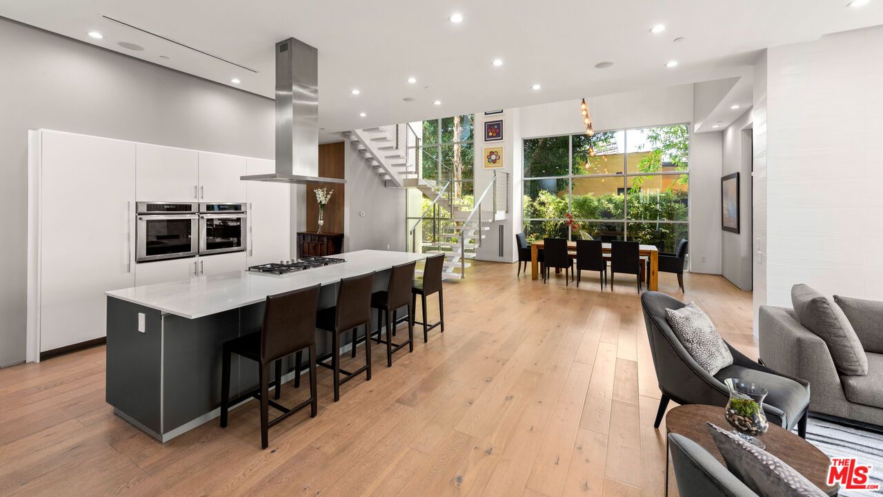 Dining room, Interior, Kitchen, Pendant Lights, Recessed Lighting, Stainless Steel Appliances, Wood Texture Flooring