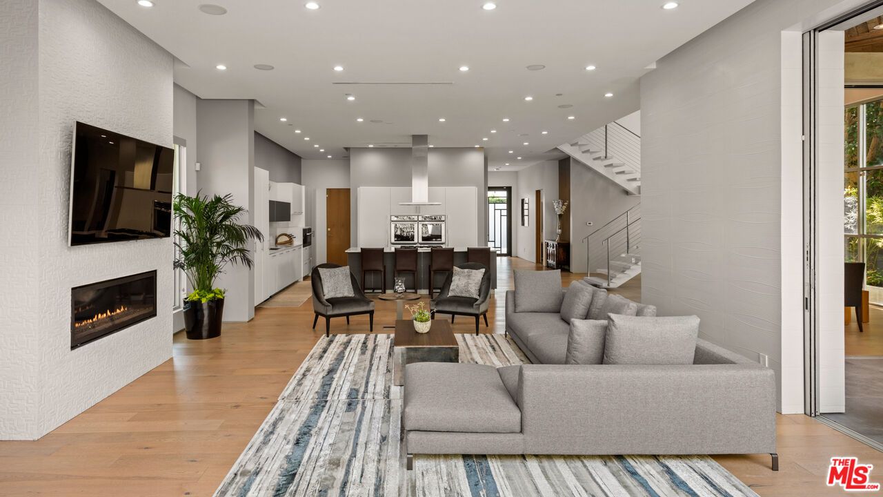 Dining room, Fireplace, Interior, Living room, Recessed Lighting, Wood Texture Flooring