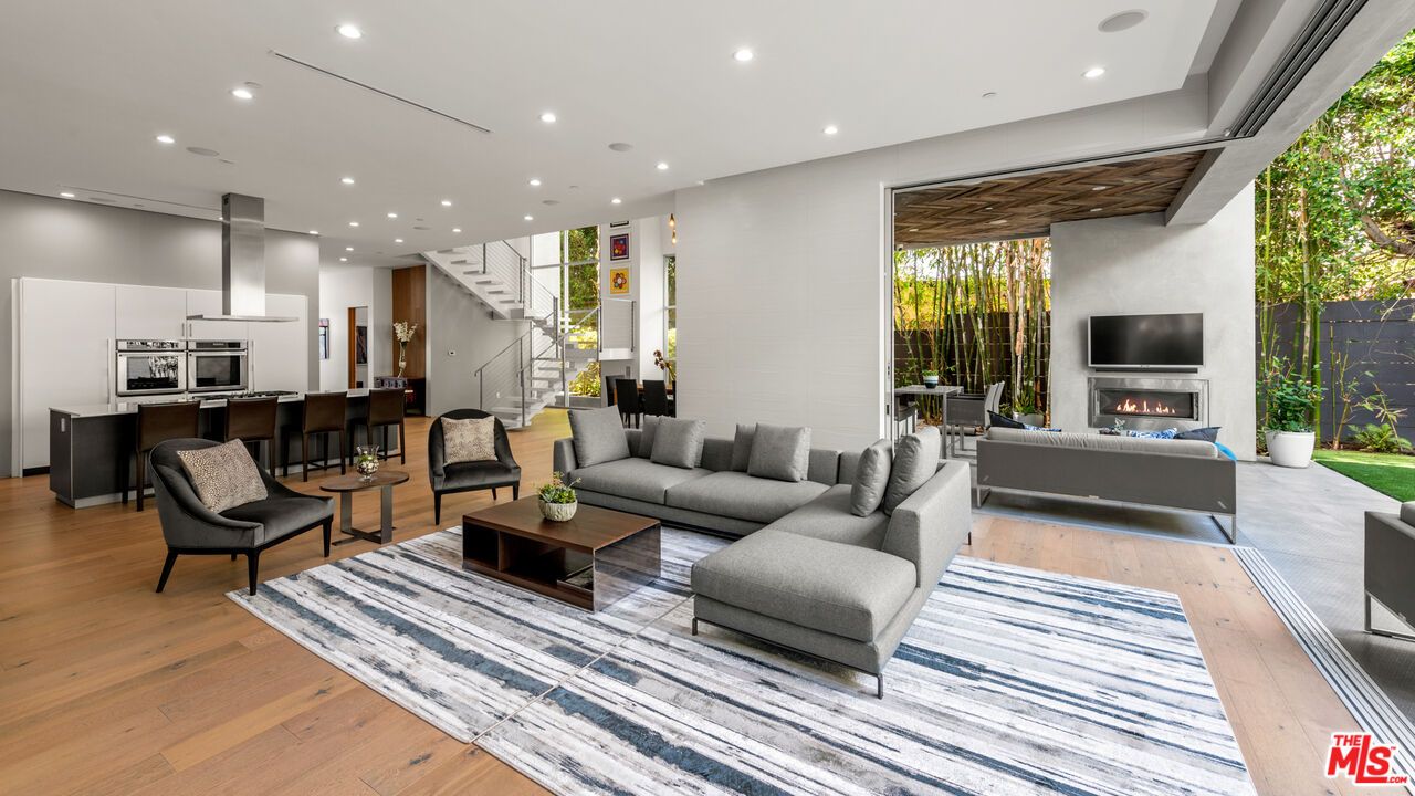 Fireplace, Interior, Kitchen, Living room, Pendant Lights, Recessed Lighting, Stainless Steel Appliances, Wood Texture Flooring