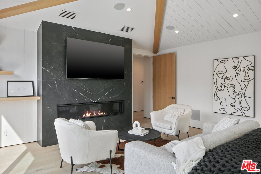 Fireplace, Interior, Living room, Marble Walls, Recessed Lighting, Wood Texture Flooring