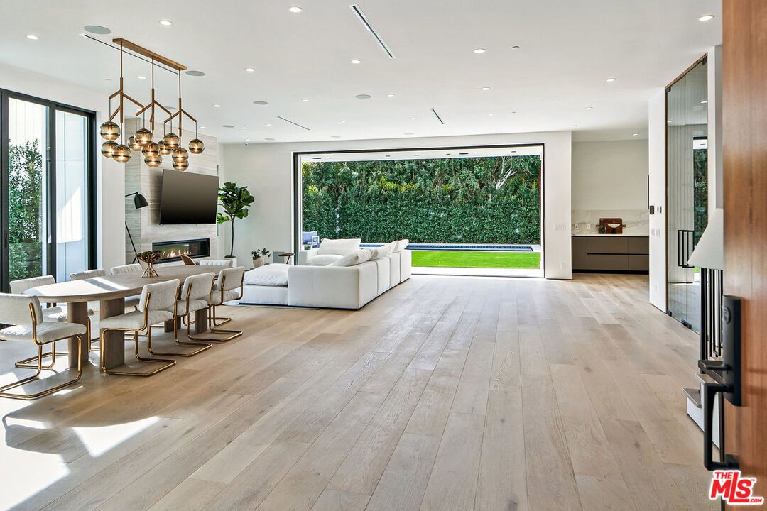 Dining room, Fireplace, Interior, Living room, Pendant Lights, Recessed Lighting, Wood Texture Flooring