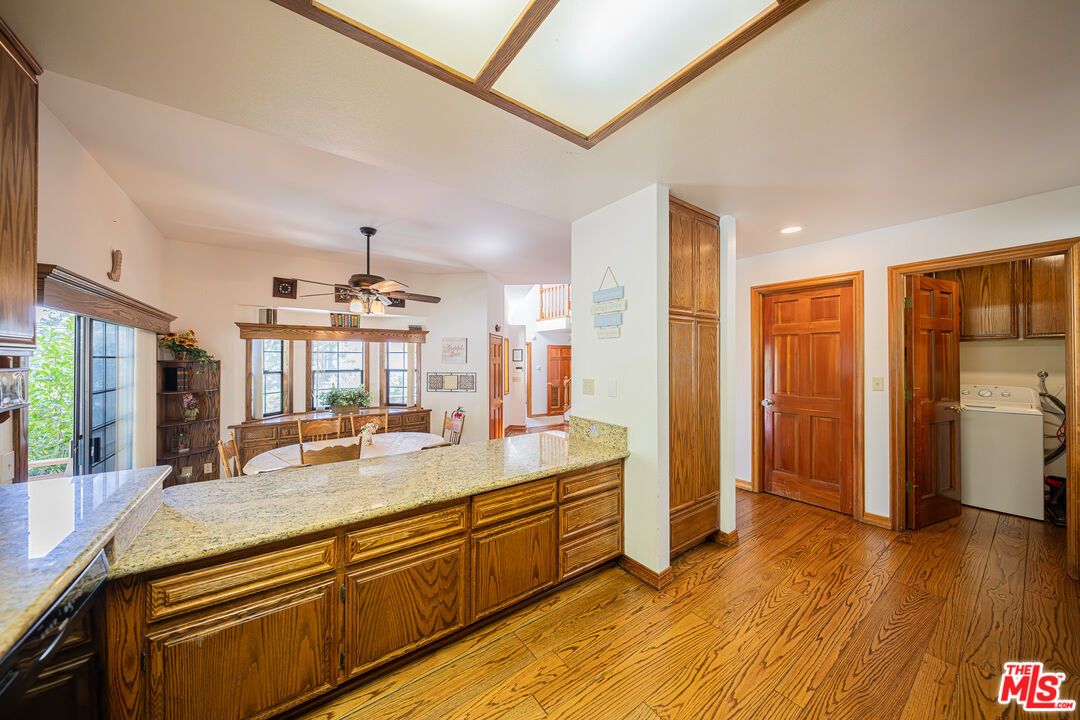 Interior, Kitchen, Recessed Lighting, Washer, Wood Texture Flooring