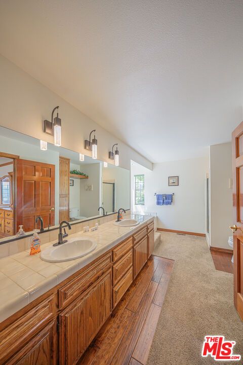 Bathroom, Dual Sink Vanities, Interior, Tile Countertops, Wood Texture Flooring