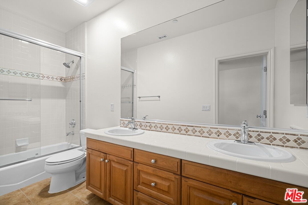 Bathroom, Dual Sink Vanities, Glass Shower, Interior, Recessed Lighting, Tile Countertops