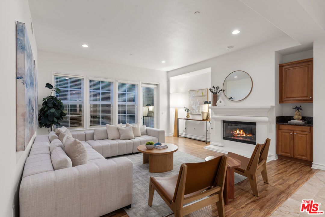 Dining room, Fireplace, Interior, Living room, Recessed Lighting, Wood Texture Flooring