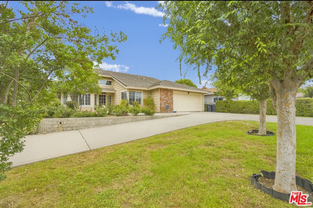 Attached, Backyard, Exterior, Facade, Brick Facade, Ranch