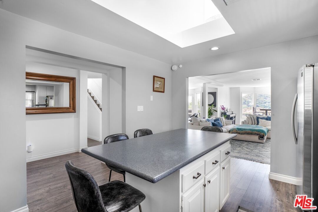 Dining room, Interior, Kitchen, Living room, Recessed Lighting, Stainless Steel Appliances, Wood Texture Flooring