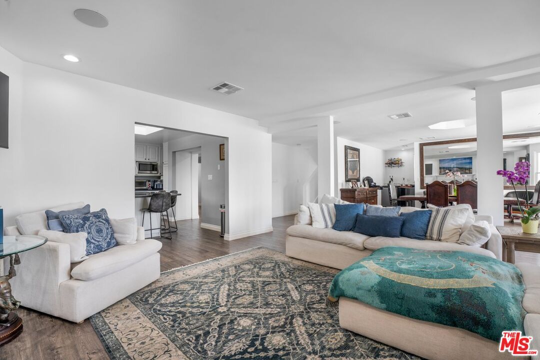Dining room, Interior, Kitchen, Living room, Recessed Lighting, Stainless Steel Appliances, Wood Texture Flooring