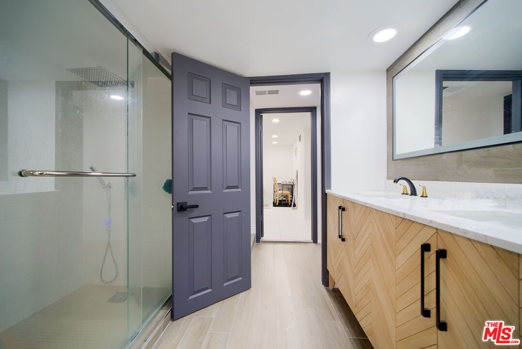 Bathroom, Dual Sink Vanities, Glass Shower, Interior, Recessed Lighting, Wood Texture Flooring