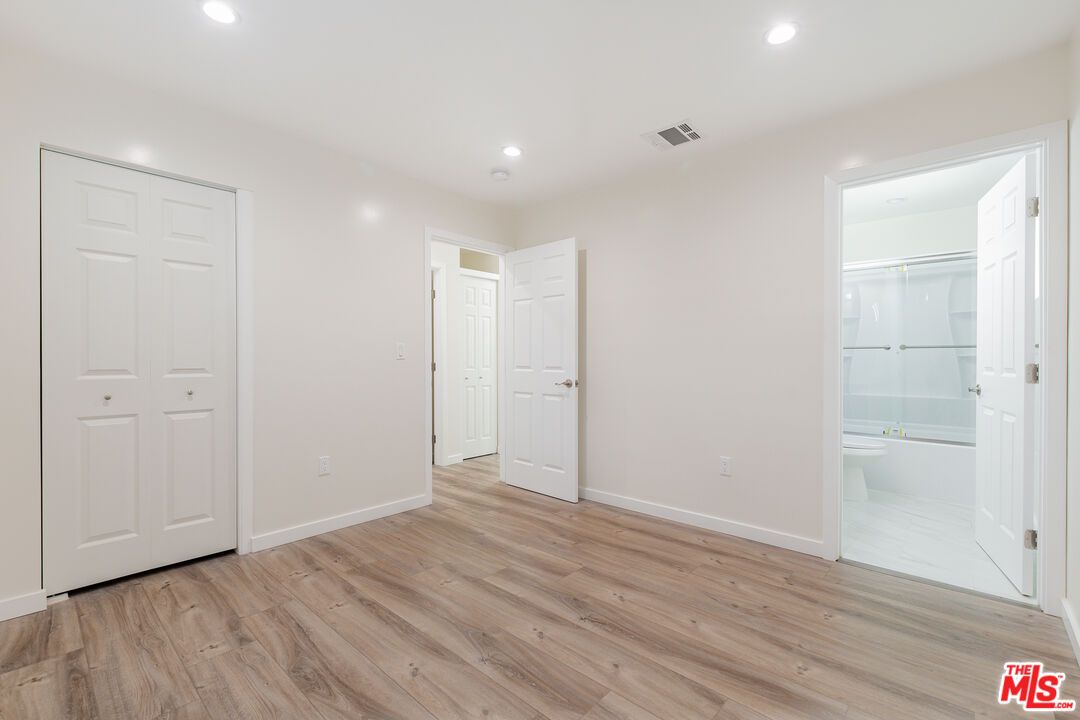 Bathroom, Empty room, Glass Shower, Interior, Recessed Lighting, Wood Texture Flooring