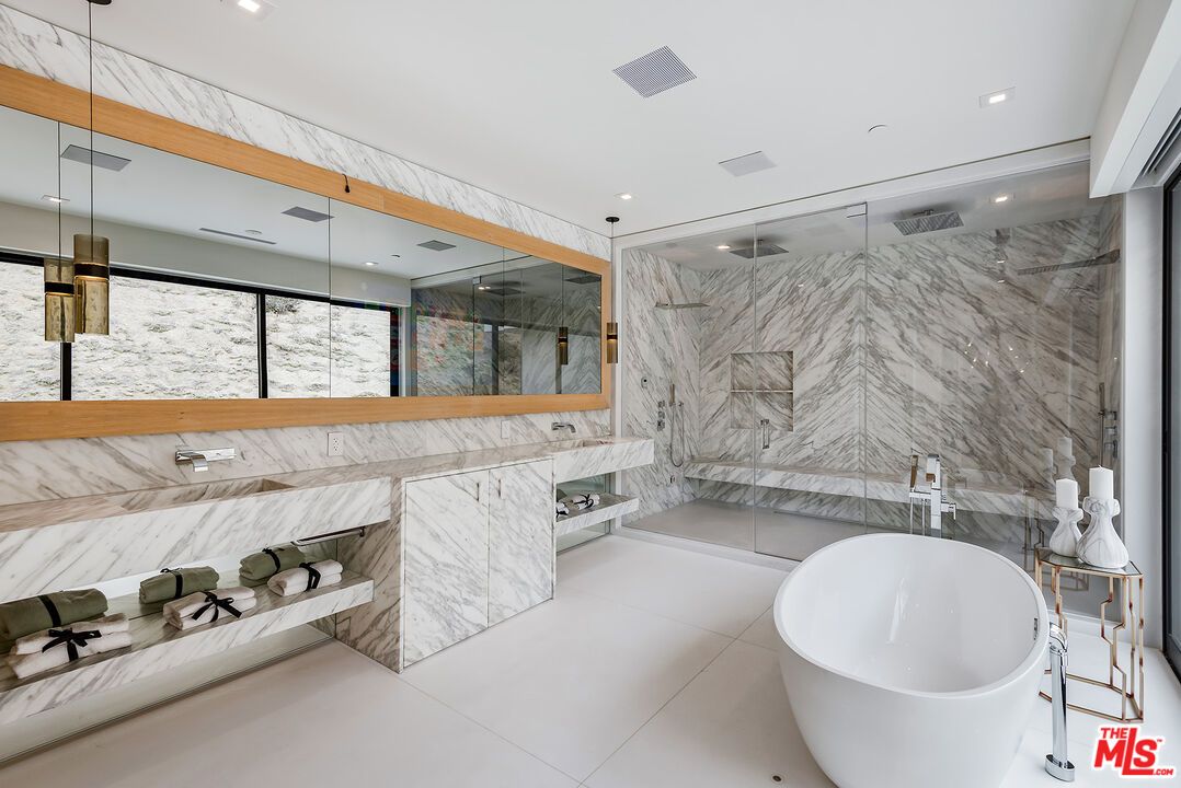 Bathroom, Dual Sink Vanities, Free Standing Baths, Glass Shower, Interior, Marble Walls, Recessed Lighting