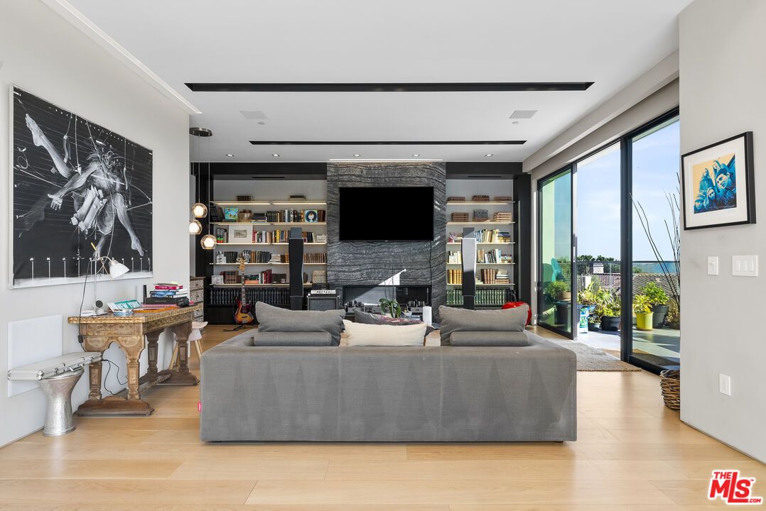 Fireplace, Interior, Living room, Recessed Lighting, Stone Walls, Wood Texture Flooring