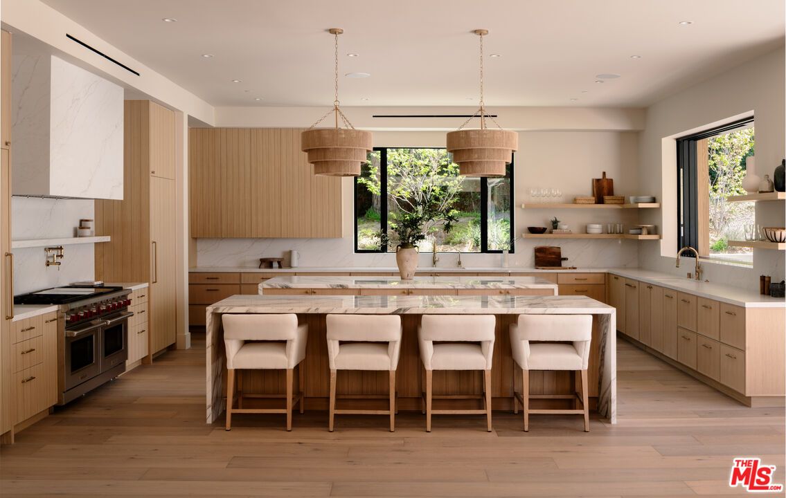 Interior, Kitchen, Marble Walls, Pendant Lights, Recessed Lighting, Stainless Steel Appliances, Wood Texture Flooring