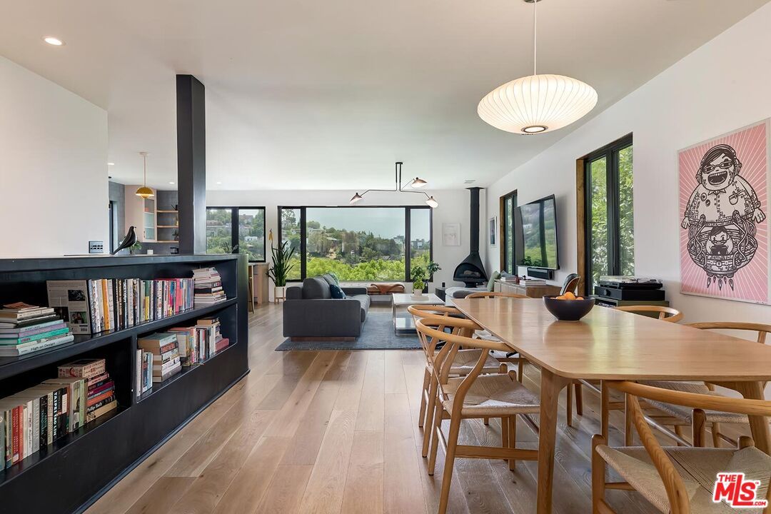 Dining room, Fireplace, Interior, Living room, Pendant Lights, Recessed Lighting, Wood Texture Flooring