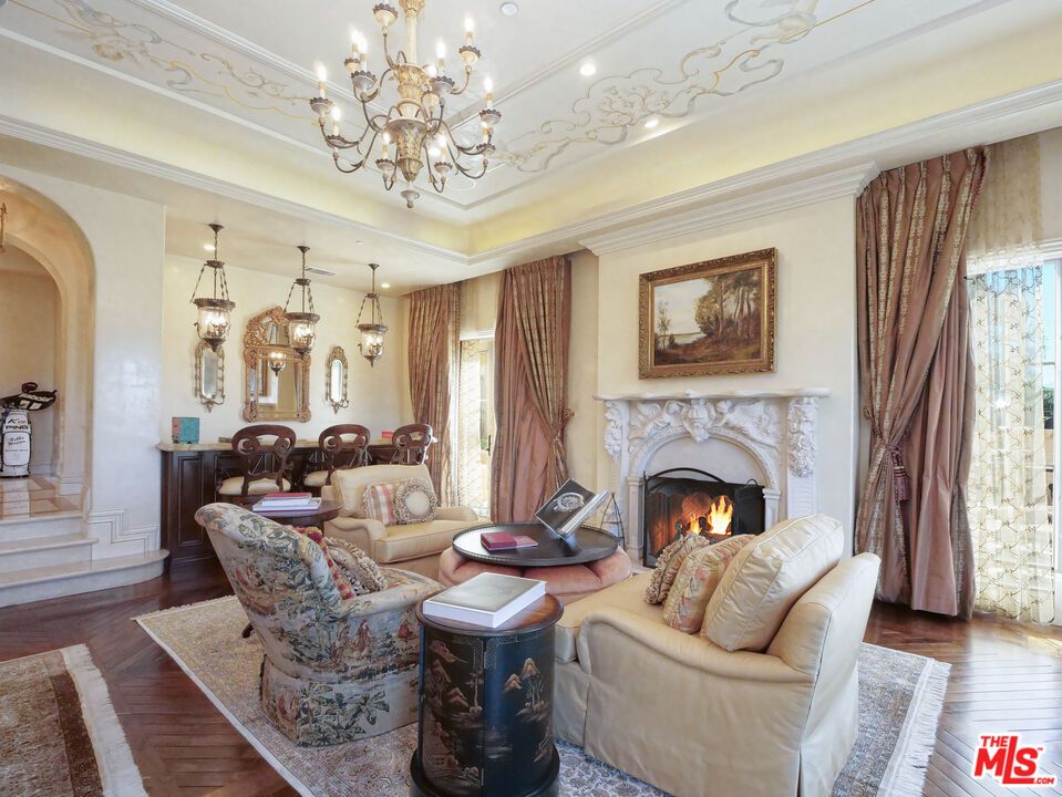 Chandelier, Dining room, Fireplace, Interior, Living room, Pendant Lights, Recessed Lighting, Wood Texture Flooring