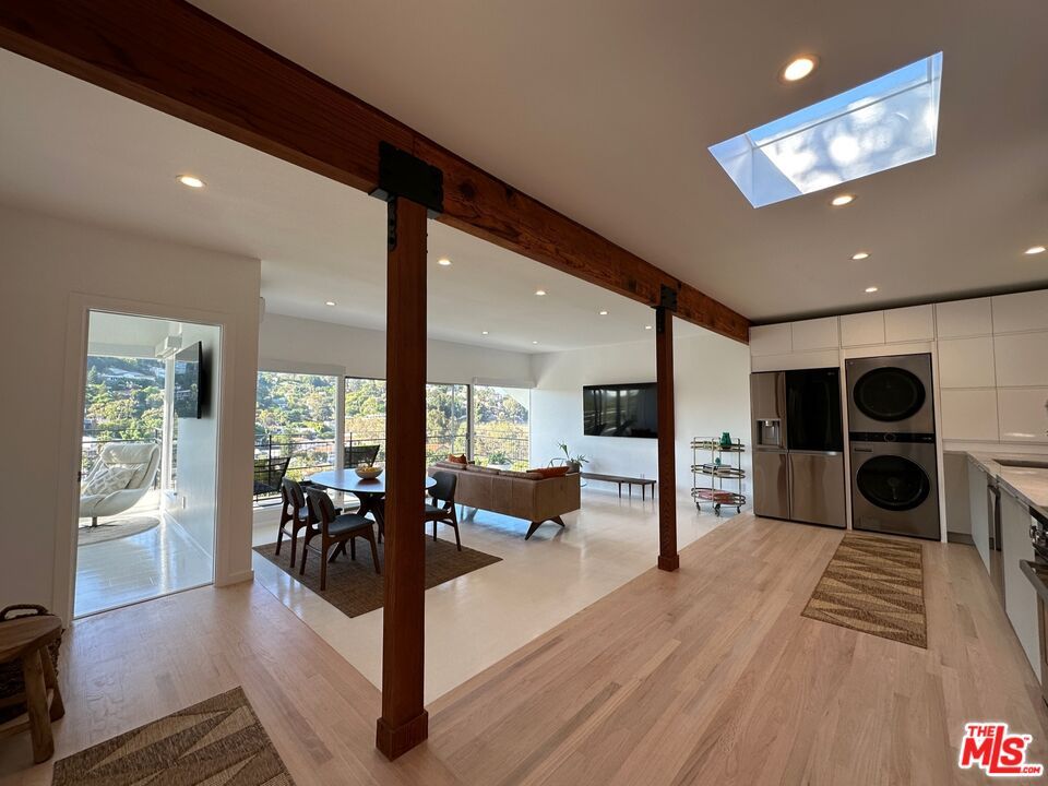 Dining room, Interior, Kitchen, Living room, Recessed Lighting, Washer, Wood Texture Flooring