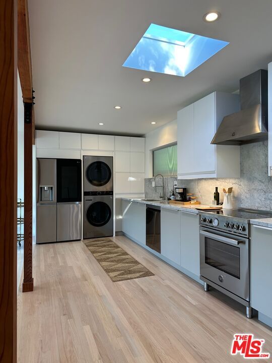 Interior, Kitchen, Recessed Lighting, Stainless Steel Appliances, Washer, Wood Texture Flooring