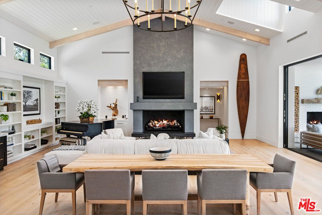 Chandelier, Dining room, Fireplace, Interior, Living room, Pendant Lights, Piano, Recessed Lighting, Wooden Beams, Wood Texture Flooring