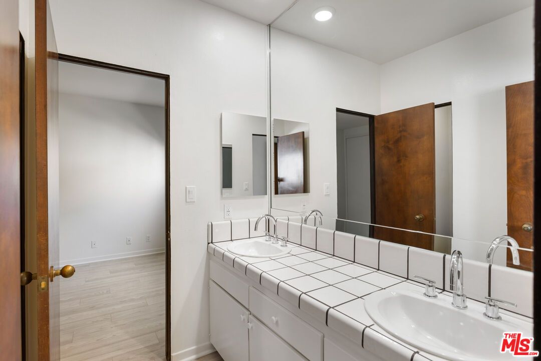 Bathroom, Dual Sink Vanities, Interior, Recessed Lighting, Tile Countertops, Wood Texture Flooring