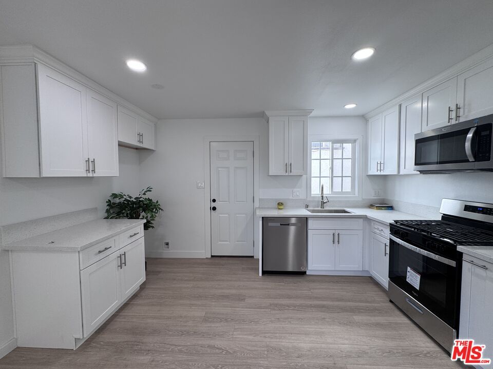Interior, Kitchen, Recessed Lighting, Stainless Steel Appliances, Wood Texture Flooring