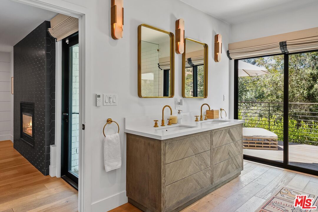 Bathroom, Dual Sink Vanities, Fireplace, Interior, Wood Texture Flooring
