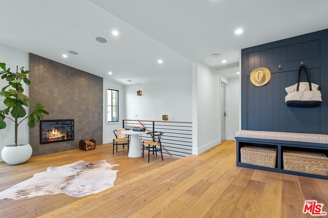 Dining room, Fireplace, Interior, Recessed Lighting, Stone Walls, Wood Texture Flooring