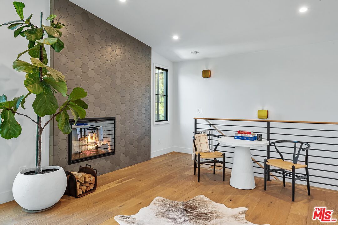 Dining room, Fireplace, Interior, Recessed Lighting, Stone Walls, Wood Texture Flooring